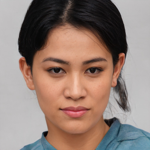 Joyful asian young-adult female with medium  brown hair and brown eyes