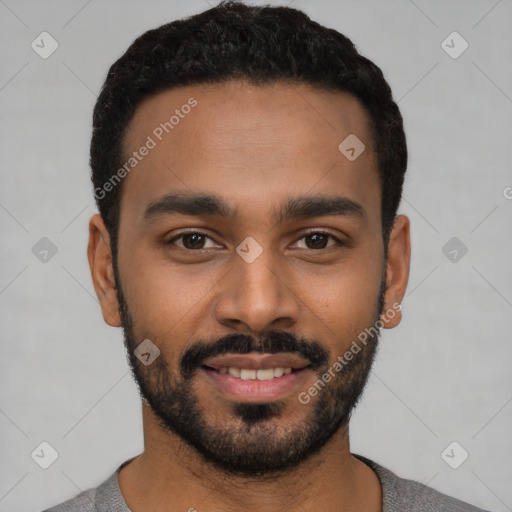 Joyful latino young-adult male with short  black hair and brown eyes