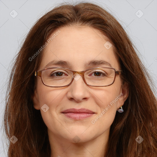 Joyful white adult female with long  brown hair and brown eyes