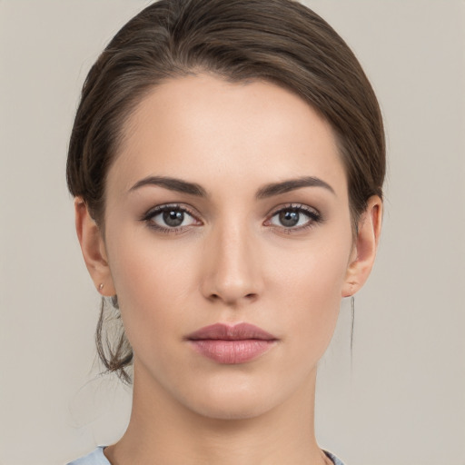 Neutral white young-adult female with medium  brown hair and brown eyes