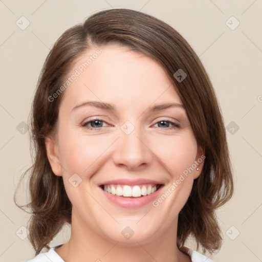 Joyful white young-adult female with medium  brown hair and green eyes