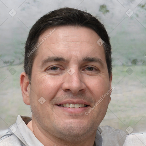 Joyful white adult male with short  brown hair and brown eyes