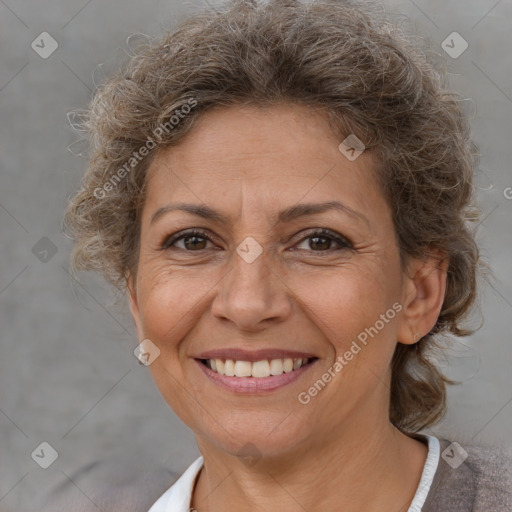 Joyful white adult female with short  brown hair and brown eyes