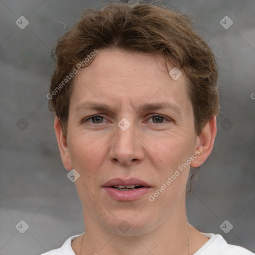 Joyful white adult male with short  brown hair and grey eyes