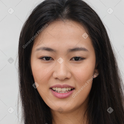 Joyful asian young-adult female with long  brown hair and brown eyes