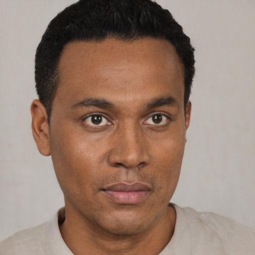 Neutral black young-adult male with short  black hair and brown eyes