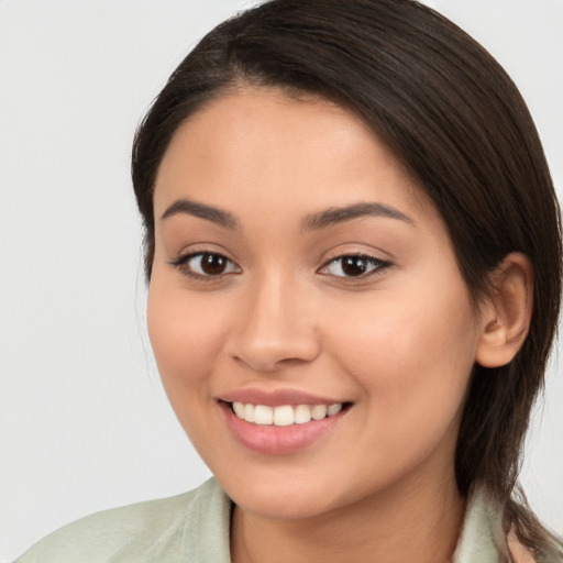 Joyful white young-adult female with medium  brown hair and brown eyes