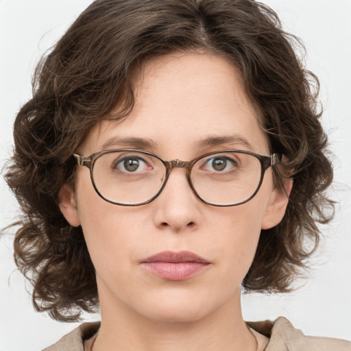 Neutral white adult female with medium  brown hair and green eyes