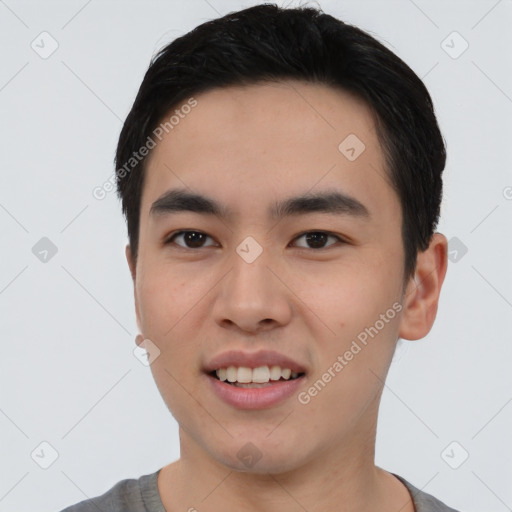 Joyful white young-adult male with short  black hair and brown eyes