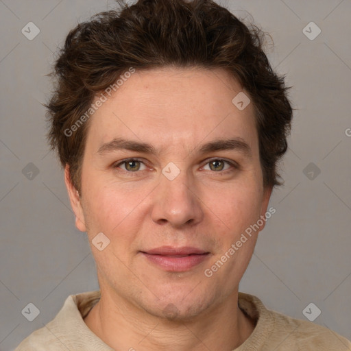 Joyful white adult male with short  brown hair and grey eyes