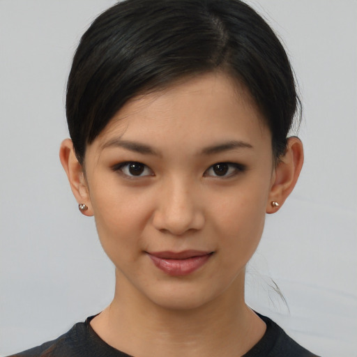 Joyful asian young-adult female with short  brown hair and brown eyes