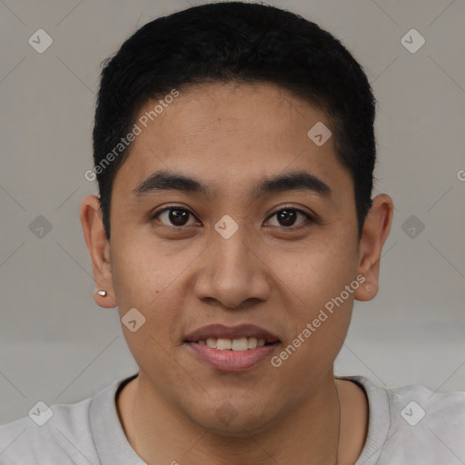 Joyful latino young-adult male with short  black hair and brown eyes