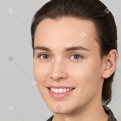 Joyful white young-adult female with medium  brown hair and brown eyes