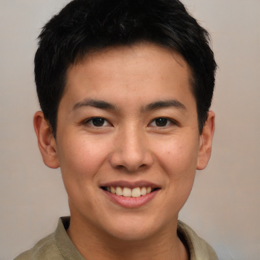 Joyful asian young-adult male with short  brown hair and brown eyes