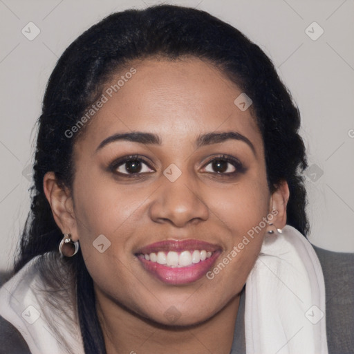 Joyful latino young-adult female with long  brown hair and brown eyes