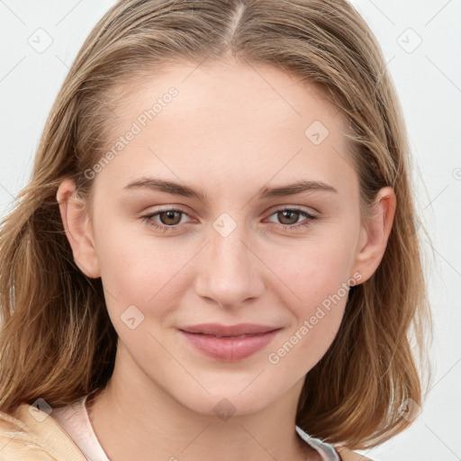 Joyful white young-adult female with long  brown hair and blue eyes