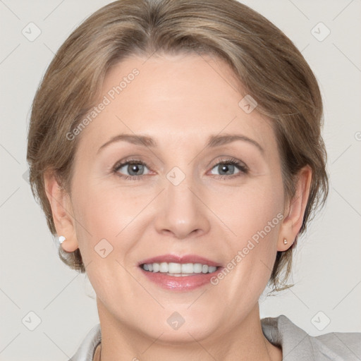 Joyful white adult female with medium  brown hair and grey eyes