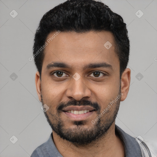 Joyful black young-adult male with short  black hair and brown eyes