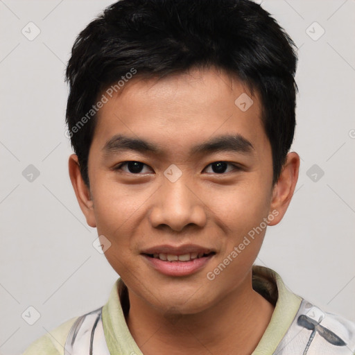 Joyful asian young-adult male with short  black hair and brown eyes