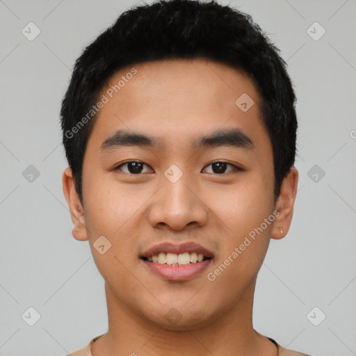 Joyful asian young-adult male with short  black hair and brown eyes