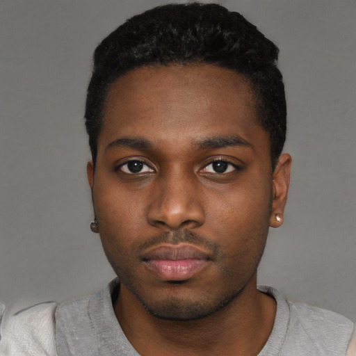 Neutral black young-adult male with short  black hair and brown eyes