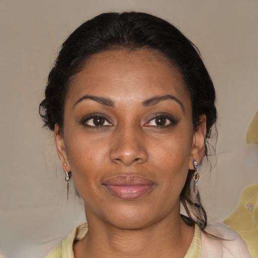 Joyful black young-adult female with medium  brown hair and brown eyes