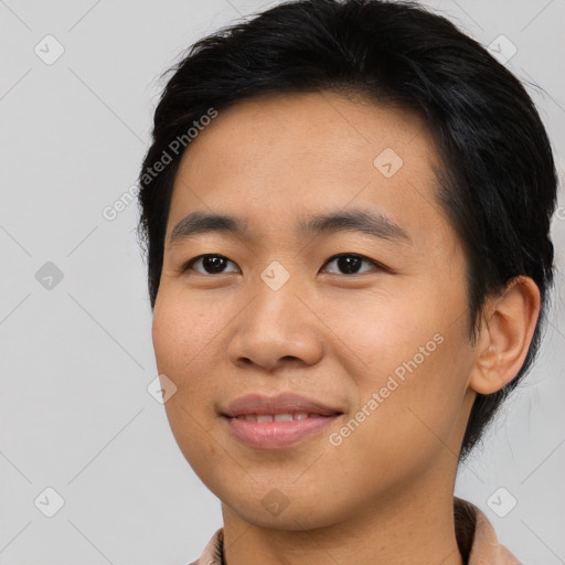 Joyful asian young-adult male with short  brown hair and brown eyes