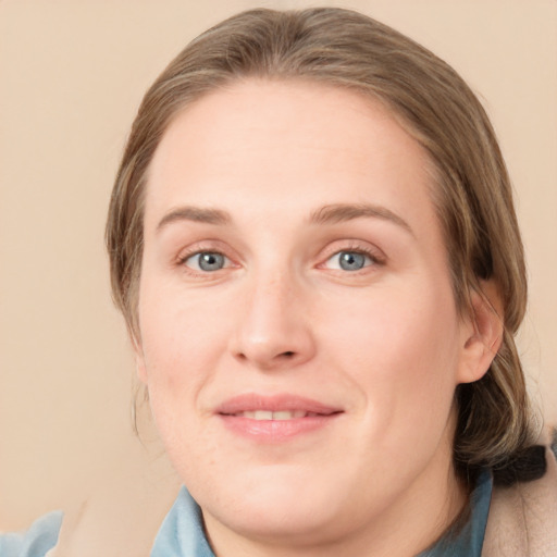 Joyful white young-adult female with medium  brown hair and blue eyes