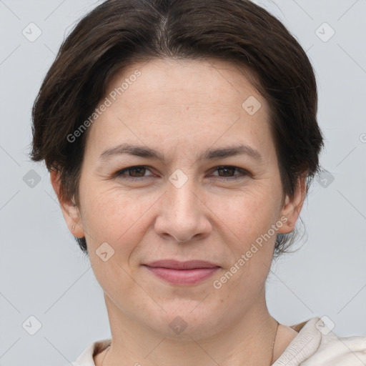 Joyful white adult female with short  brown hair and brown eyes