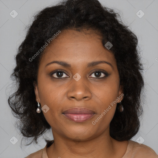 Joyful black young-adult female with long  brown hair and brown eyes