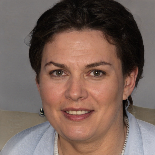 Joyful white adult female with short  brown hair and brown eyes