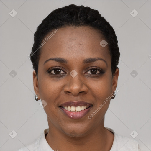 Joyful black young-adult female with short  black hair and brown eyes