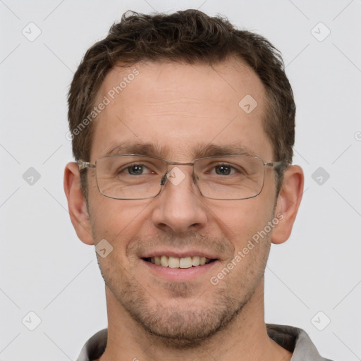 Joyful white adult male with short  brown hair and brown eyes