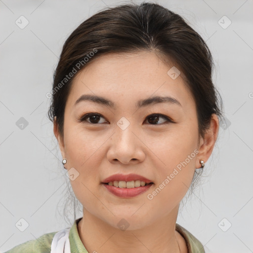 Joyful asian young-adult female with medium  brown hair and brown eyes