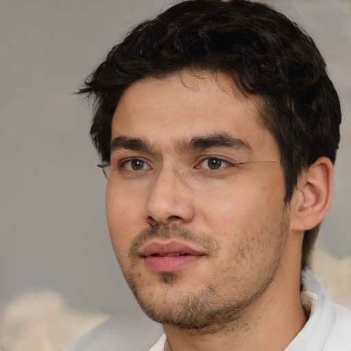 Joyful white adult male with short  black hair and brown eyes