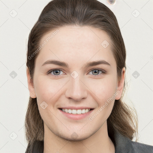 Joyful white young-adult female with long  brown hair and grey eyes