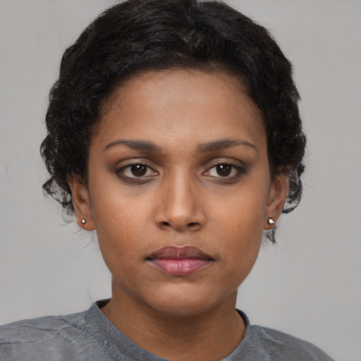 Neutral black young-adult female with short  black hair and brown eyes