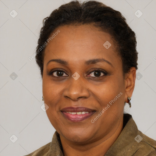 Joyful black adult female with short  brown hair and brown eyes