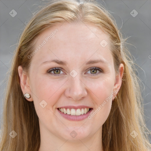 Joyful white young-adult female with long  brown hair and blue eyes