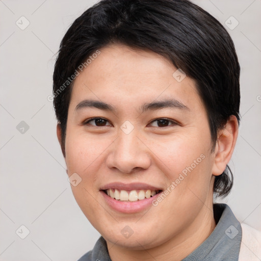 Joyful white young-adult female with short  brown hair and brown eyes