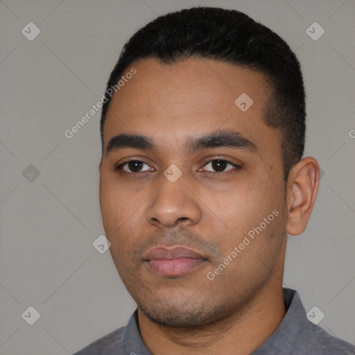 Neutral latino young-adult male with short  black hair and brown eyes