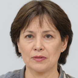 Joyful white middle-aged female with medium  brown hair and brown eyes