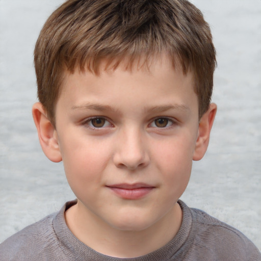 Joyful white child male with short  brown hair and brown eyes