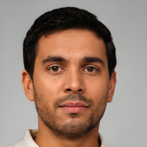 Neutral latino young-adult male with short  brown hair and brown eyes