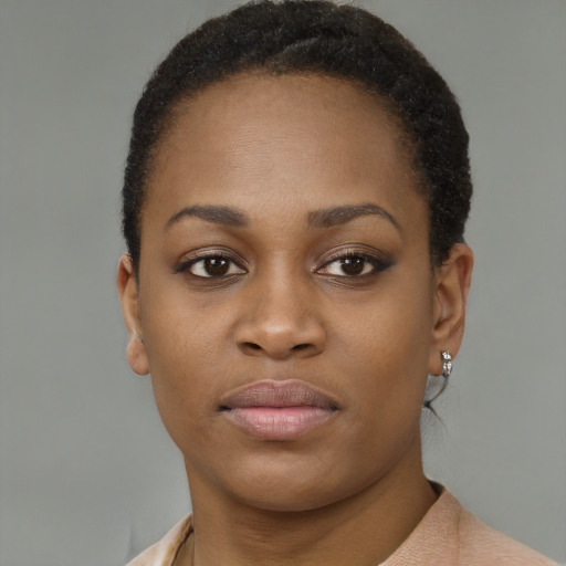 Neutral black young-adult female with short  brown hair and brown eyes