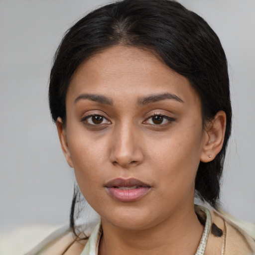Neutral white young-adult female with medium  brown hair and brown eyes