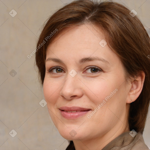 Joyful white adult female with medium  brown hair and brown eyes