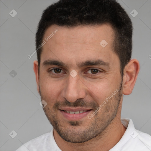 Joyful white adult male with short  brown hair and brown eyes