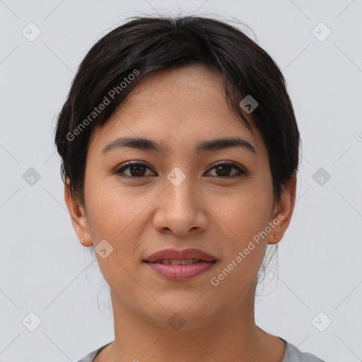 Joyful asian young-adult female with short  brown hair and brown eyes