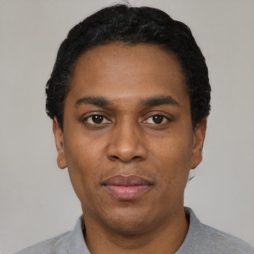 Neutral black adult male with short  black hair and brown eyes